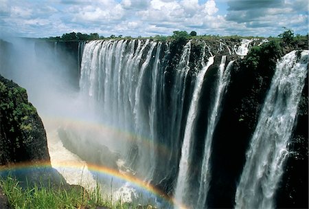 Waterfalls and rainbows, Victoria Falls, UNESCO World Heritage Site, Zambia, Africa Foto de stock - Con derechos protegidos, Código: 841-02711741