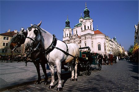 Horse and carriage and church of St. Nicholas, Old Town Square, Prague, Czech Republic, Europe Stock Photo - Rights-Managed, Code: 841-02713811