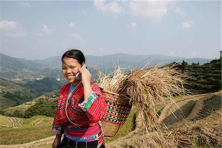 Woman of Yao minority with cellphone, Longsheng terraced ricefields, Guilin, Guangxi Province, China, Asia Stock Photo - Rights-Managed, Code: 841-02720853