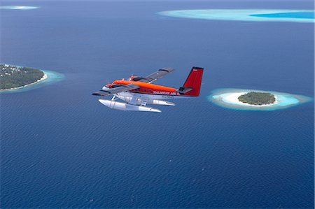 Aerial view of Maldivian air taxi flying above islands in the Maldives, Indian Ocean, Asia Foto de stock - Con derechos protegidos, Código: 841-02722614