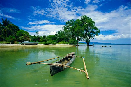 Outrigger canoe and beach, Ujong Kulon Reserve, Handeuleum Island, western Java, Indonesia Stock Photo - Rights-Managed, Code: 841-02722761