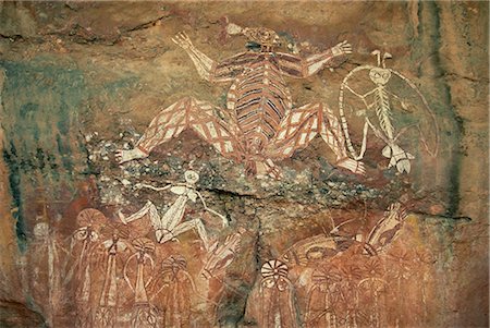 parc national de kakadu - Namondjok dans le centre, qui a mangé sa sœur clan, Namarrgon le droit de l'homme de la foudre et Barrginj sa femme dessous gauche ancêtres surnaturels dans le site d'art rupestre, Nourlangie Rock, Kakadu National Park, site du patrimoine mondial de l'UNESCO, Northern Territory, Australie, Pacifique Photographie de stock - Rights-Managed, Code: 841-02722974