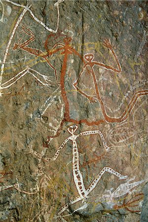 parque nacional de kakadu - Painting of dancing figures at Nourlangie Rock, sacred aboriginal shelter and rock art site in the north east of Kakadu National Park, UNESCO World Heritage Site, Northern Territory, Australia, Pacific Foto de stock - Direito Controlado, Número: 841-02722976