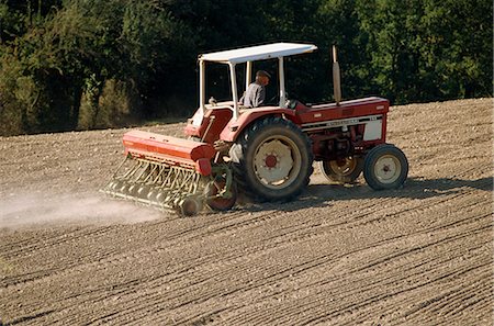 drilling machine - A tractor with a seed drill, drilling rape seed in autumn in the Tarn, France, Europe Stock Photo - Rights-Managed, Code: 841-02831097