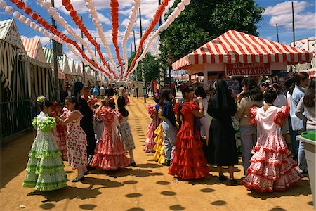 Spanish young woman dressed in sevillana traditional attire MR