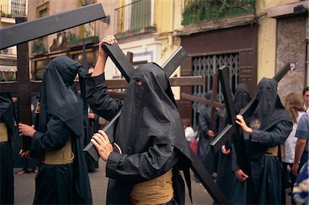 spain festival - Penitents bearing crosses in procession, Holy Week (Semana Santa), Seville, Andalucia, Sapin, Europe Stock Photo - Rights-Managed, Code: 841-02831221