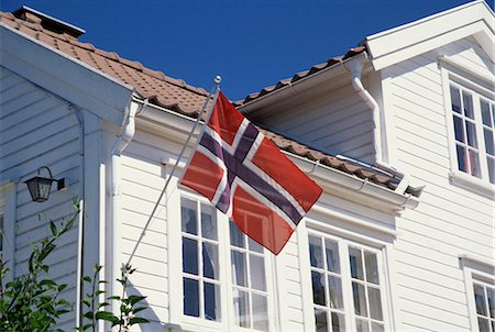 Flag on house, Lillesand, south coast, Norway, Scandinavia, Europe Stock Photo - Rights-Managed, Code: 841-02831646