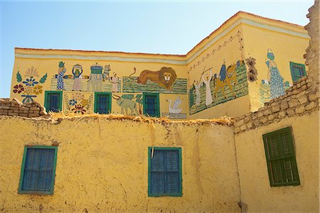 decorated houses in africa - Traditional architecture with murals indicating a visit to Mecca, Dra Abul Naga village, near Luxor, Thebes, Egypt, North Africa, Africa Stock Photo - Rights-Managed, Code: 841-02832143