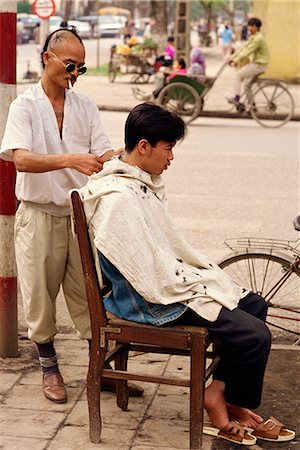 A street hair stylist on the pavement in the centre of the city of Hanoi, Vietnam, Indochina, Southeast Asia, Asia Stock Photo - Rights-Managed, Code: 841-02832845