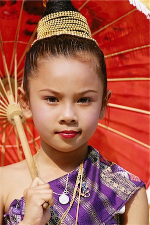 Young Laotian girl in traditional dress holding a red parasol, Laos, Indochina, Southeast Asia, Asia Stock Photo - Rights-Managed, Code: 841-02899090