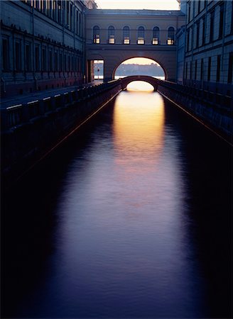 Dusk light reflected on the Winter Canal, through arch and bridge, St. Petersburg, Russia, Europe Stock Photo - Rights-Managed, Code: 841-02899297