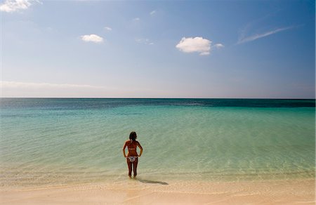 A lone woman in a bikini in the sea at Playa Ancon, Trinidad, Cuba, West Indies, Central America Stock Photo - Rights-Managed, Code: 841-02899883