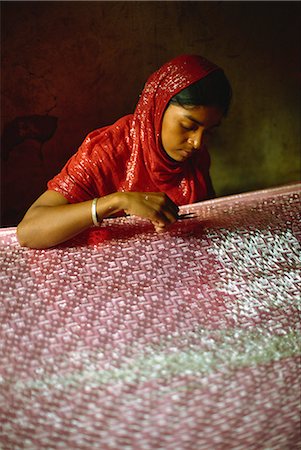 Clipping and finishing off a Benares silk sari, Varanasi, Uttar Pradesh state, India, Asia Stock Photo - Rights-Managed, Code: 841-02900217