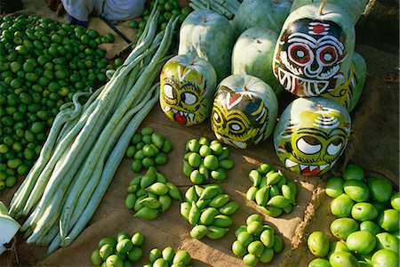 pictures of vegetables market place of india - Green mangoes, snake gourds and squash painted with faces to hang in shop front to keep off evil spirits, India, Asia Stock Photo - Rights-Managed, Code: 841-02900275