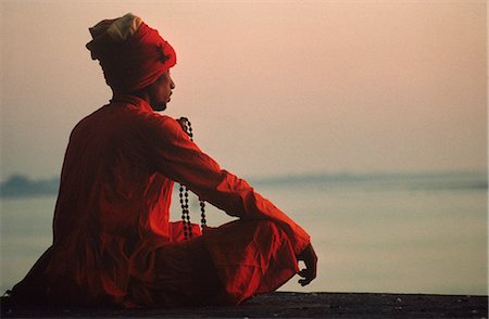 Man with rosary meditating on the banks of the River Ganges, Varanasi, Uttar Pradesh state, India, Asia Stock Photo - Rights-Managed, Code: 841-02900334