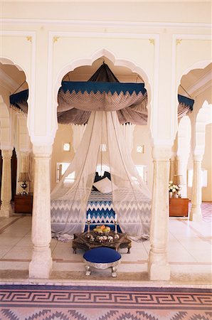 Traditional Rajput columns and cuspid arches in tented guest bedroom, Samode Palace Hotel, Samode, Rajasthan state, India, Asia Stock Photo - Rights-Managed, Code: 841-02900528