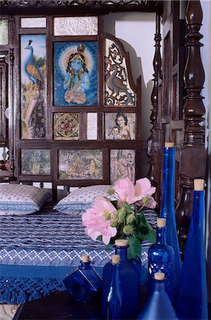 Colonial style bed with bed headboard inlaid with 19th century prints of the god Krishna, residential home, Dehra Dun, Himalayan foot hills, Uttar Pradesh, India, Asia Stock Photo - Rights-Managed, Code: 841-02900549