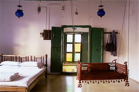 furniture india - Bedroom with traditional hitchkar suspended swing seat in restored traditional Pol house, Ahmedabad, Gujarat state, India, Asia Stock Photo - Rights-Managed, Code: 841-02900615