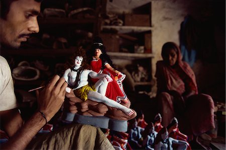 painter, male - Painting a clay model of Shiva and his consort Parvati, Varanasi, Uttar Pradesh state, India, Asia Stock Photo - Rights-Managed, Code: 841-02901006