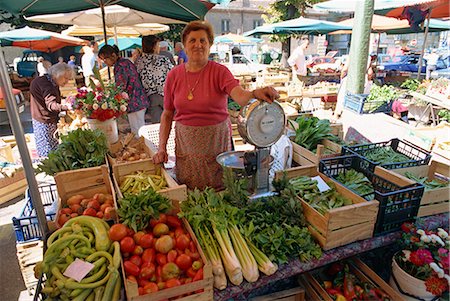 Woman selling fruit, vegetables and flowers on a stall in the street market in Asti, Piedmont, Italy, Europe Stock Photo - Rights-Managed, Code: 841-02901056