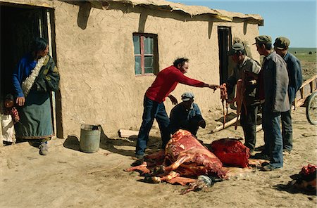 Tibetans preparing yak meat, Qinghai, China, Asia Foto de stock - Con derechos protegidos, Código: 841-02901215