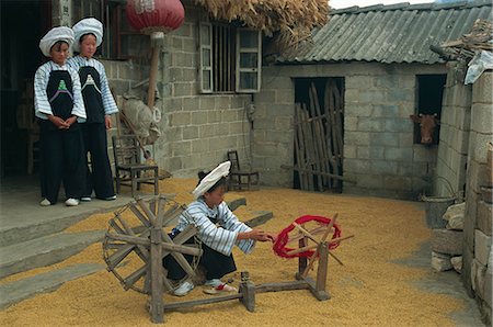 Bouyei girl winding a bobbin for weaving, south Guizhou, Guizhou, China, Asia Stock Photo - Rights-Managed, Code: 841-02901330