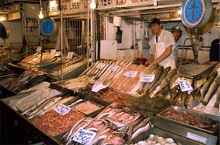 A fishmonger and scales in the fish market in the Mercado Central in Santiago, Chile, South America Stock Photo - Rights-Managed, Code: 841-02901725