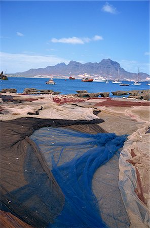 Nets laid out to dry on dockside, Mindelo, Sao Vicente, Cape Verde Islands, Atlantic, Africa Stock Photo - Rights-Managed, Code: 841-02901764