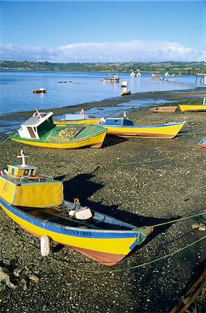 Fishing boats on the beach, zone of Dalcahue, near Castro, Chiloe island, Chile, South America Fotografie stock - Rights-Managed, Codice: 841-02901781