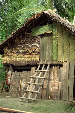papua new guinea - Maison traditionnelle avec l'échelle à la porte, Papouasie-Nouvelle Guinée, îles du Pacifique, Pacifique Photographie de stock - Rights-Managed, Code: 841-02902010