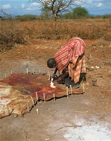 Maasai lady working on animal skin, Kenya, East Africa, Africa Stock Photo - Rights-Managed, Code: 841-02902757
