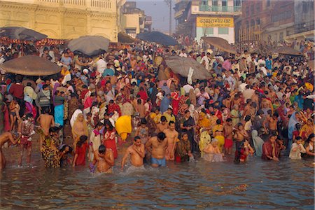 Hindu religious morning rituals in the Ganges (Ganga) River, Makar San Kranti festival, Varanasi (Benares), Uttar Pradesh State, India Stock Photo - Rights-Managed, Code: 841-02903361