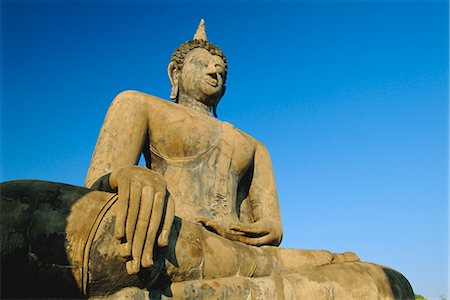 simsearch:841-03067296,k - Seated Buddha statue in the Historical Park, old Sukhothai (Muang Kao), Sukhothai, Thailand Stock Photo - Rights-Managed, Code: 841-02903685