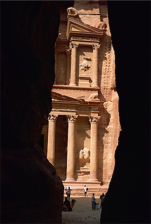 siq gorge - First view of Petra at the end of the Siq entrance gorge, Petra, UNESCO World Heritage Site, Jordan, Middle East Stock Photo - Rights-Managed, Code: 841-02915511