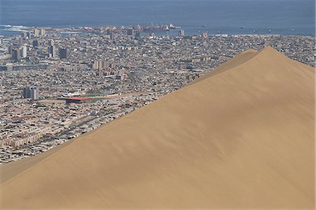 sand dunes large - Giant sand dune above large city, Iquique, Atacama coast, Chile, South America Stock Photo - Rights-Managed, Code: 841-02915852