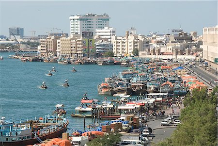 dhow boat - Dhows moored for unloading alongside Deira wharves, Dubai Creek, Dubai, United Arab Emirates, Middle East Stock Photo - Rights-Managed, Code: 841-02915888