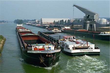 Large barges pass on busy canal near the Netherlands border, northern Germany, Europe Stock Photo - Rights-Managed, Code: 841-02915935