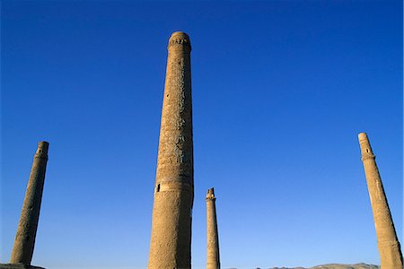 simsearch:841-02917073,k - Four of the six remaining minarets marking the corners of the long gone Madrassa built by the last Timurid ruler Sultan Husain Baiquara, within the Mousallah Complex of Gaur Shad's mausoleum, Herat, Afghanistan, Asia Fotografie stock - Rights-Managed, Codice: 841-02916615