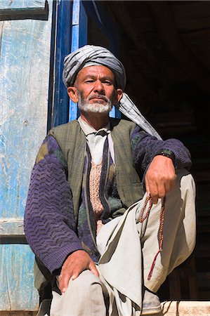 simsearch:841-02944896,k - Portrait of a man sitting in doorway, Syadara, between Yakawlang and Daulitiar, Afghanistan, Asia Stock Photo - Rights-Managed, Code: 841-02916856