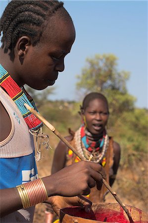 simsearch:841-02920040,k - Hamer man stirring cows blood ready for drinking, Dombo village, Turmi, Lower Omo valley, Ethiopia, Africa Stock Photo - Rights-Managed, Code: 841-02916989