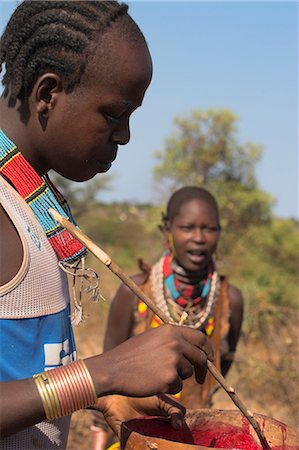 simsearch:841-02916988,k - Hamer man stirring cows blood ready for drinking, Dombo village, Turmi, Lower Omo valley, Ethiopia, Africa Stock Photo - Rights-Managed, Code: 841-02916989