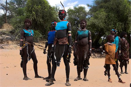 song and dance - Women sing and dance before the bull jumping, Hamer Jumping of the Bulls initiation ceremony, Turmi, Lower Omo valley, Ethiopia, Africa Stock Photo - Rights-Managed, Code: 841-02916981