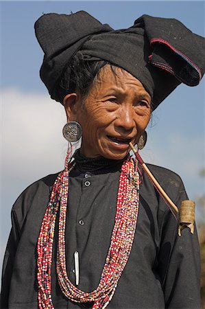 Aku lady smoking wooden pipe, Wan Sai village, Kengtung (Kyaing Tong), Shan state, Myanmar (Burma), Asia Stock Photo - Rights-Managed, Code: 841-02917010