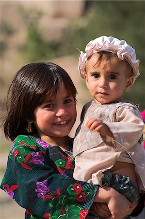 Aimaq girl holding baby, Pal-Kotal-i-Guk, between Chakhcharan and Jam, Afghanistan, Asia Stock Photo - Rights-Managed, Code: 841-02917111