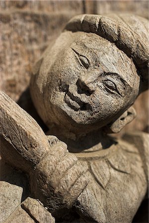 Carving on traditional wooden monastery, once part of the Royal Palace complex and used as an apartment by King Mindon, Shwenandaw Kyaung (Golden Palace Monastery), Mandalay, Myanmar (Burma), Asia Stock Photo - Rights-Managed, Code: 841-02917133