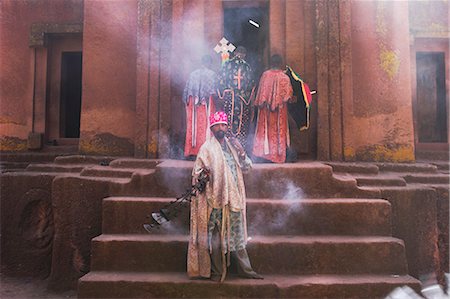 priest ethiopia - Priest swings an incense burner at the rock-hewn monolithic church of Bet Giyorgis (St. George's), most famous of Lalibela's churhces, Lalibela, UNESCO World Heritage Site, Ethiopia, Africa Stock Photo - Rights-Managed, Code: 841-02917215