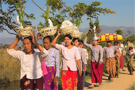 People walking to Monastery carrying offerings on their heads, Novice monk ceremony, Inle Lake, Shan State, Myanmar (Burma), Asia Stock Photo - Rights-Managed, Code: 841-02917339