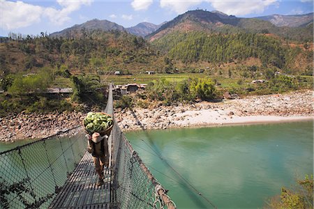 porter - Man carrying vegetables across a rope bridge, Trisuli Center, Bandare Village, Trisuli Valley, Nepal, Asia Stock Photo - Rights-Managed, Code: 841-02917405
