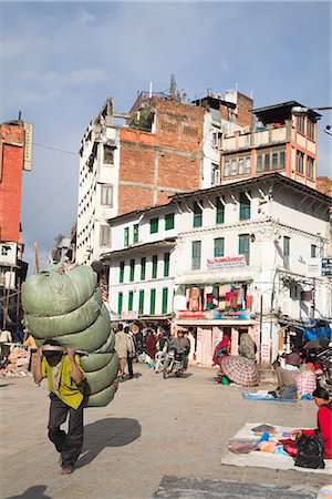 Man carrying heavy load through the street, Hanuman Dhoka, Durbar Square, UNESCO World Heritage Site, Kathmandu, Nepal, Asia Stock Photo - Rights-Managed, Code: 841-02917412