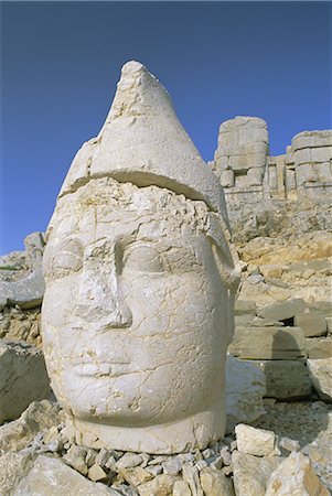 Ancient carved heads of gods on summit of Mount Nemrut, Nemrut Dagi (Nemrut Dag), UNESCO World Heritage Site, Anatolia, Turkey, Asia Minor, Asia Stock Photo - Rights-Managed, Code: 841-02917986
